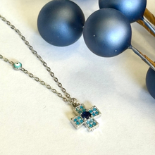 Load image into Gallery viewer, Cross Necklace with Blue Stones and Evil Eye Accent
